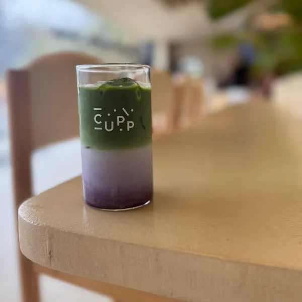 Iced matcha over butterfly pea milk