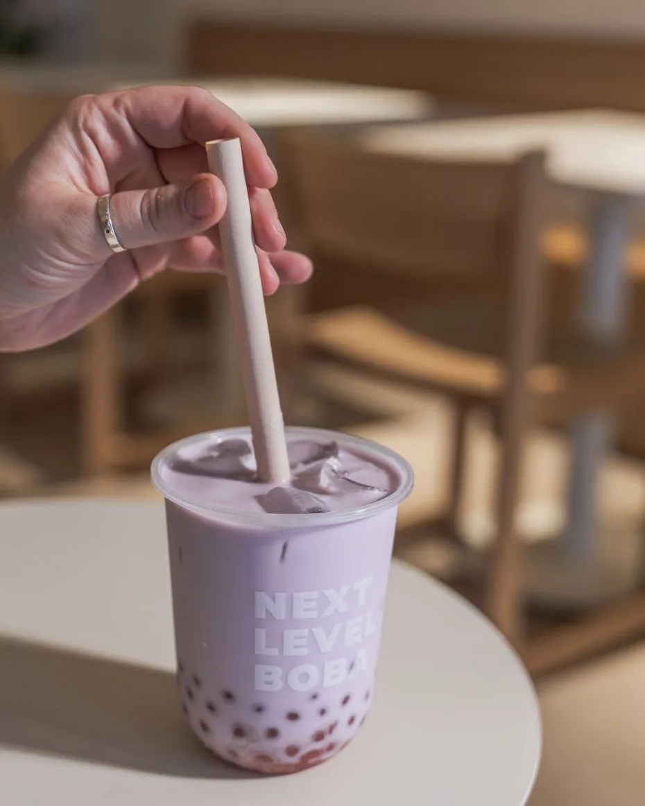 Taro milk tea with boba in a Next Level Boba cup